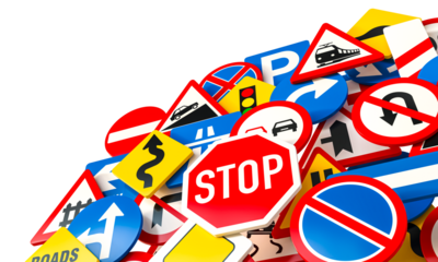 Mess of road signs over white background