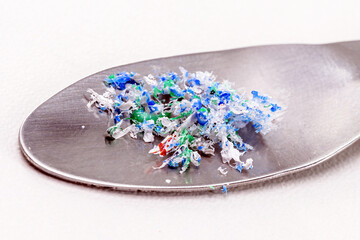 metal spatula with traces of micro plastic taken from the ocean
