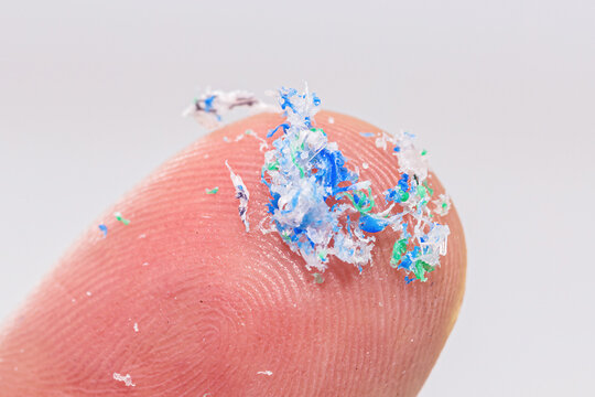 finger close-up with traces of plastic and microplastic
