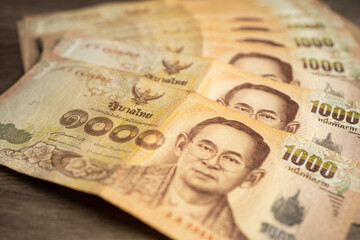 Thai baht banknotes, business saving finance investment concept.