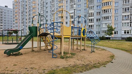 A public outdoor playground with various exercise equipment.