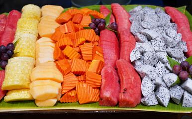 A set of chopped tropical fruit is ready to eat