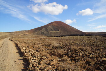 desertic landscape of volcano and caldera on the sea side