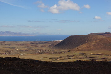 desertic landscape of volcano and caldera on the sea side