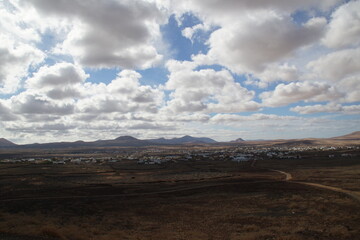 desertic landscape of volcano and caldera on the sea side