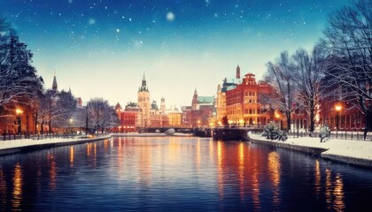Obraz premium Winter cityscape with historic buildings and snow-covered landscape by the river.