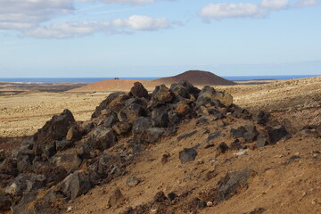 desertic landscape of volcano and caldera on the sea side