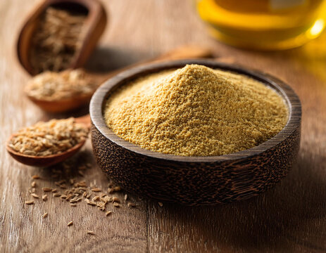A bowl of asafoetida (asafetida) on the table. 