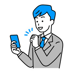 スマートフォンの画面を見ながらガッツポーズをするスーツの男性