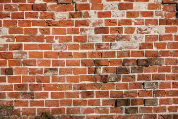 An old red brick brick wall, a place for an inscription