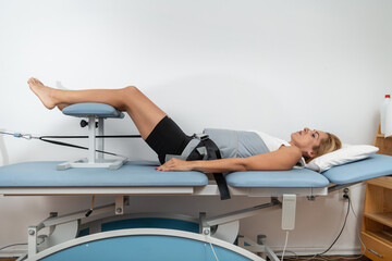 Mechanical traction is used to relieve back pain and stiffness by gently stretching the spine, reducing pressure on spinal discs, and promoting better mobility and recovery