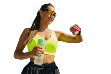 A Fitness Enthusiast Checks Her Smartwatch While Holding a Water Bottle Outdoors in Bright Sunny Weather