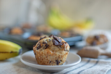 Banana chocolate chip muffins on a baking rack