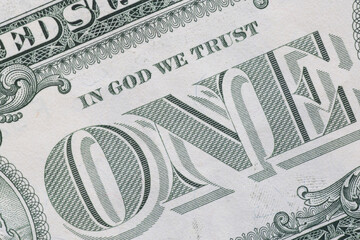 message in God we trust on one dollar banknote