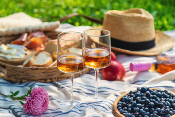 Glasses of wine at a picnic. Selective focus.