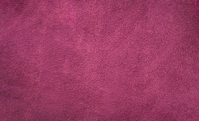 Grape color textured surface with copy space
