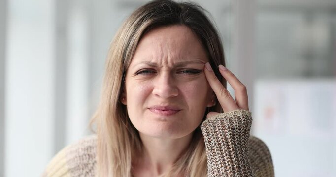 Woman experiences pain and discomfort in eyes at home
