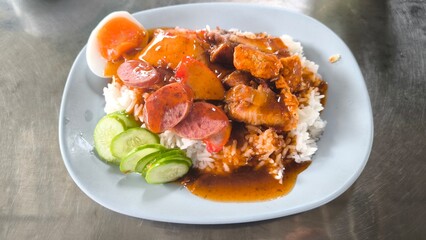 Red pork and crispy pork on rice, food in Thailand.