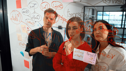 Young creative start up business team brainstorming idea and solving problems by using colorful sticky note and mind map at glass board, modern meeting room. discussing, working together. Immaculate.