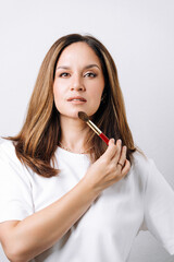 portrait of makeup artist on white background