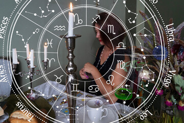 A stylish woman elegantly enjoys a vibrant green cocktail while sitting in a moody and inviting atmosphere