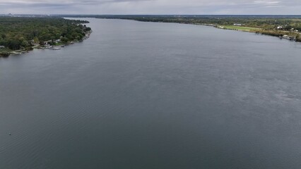 Traveling  by Niagara River above Niagara Falls in New York State with storm clouds 