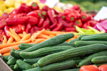 Fresh vegetables displayed on a farmer's market counter
