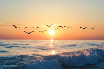 Naklejka premium A captivating sunset glows over ocean waves, with birds soaring in the sky, highlighting nature's beauty and freedom.