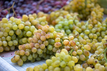 grapes displayed on a farmer's market counter