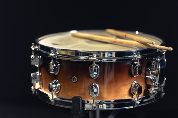 Drum close-up. Drumsticks with a drum.