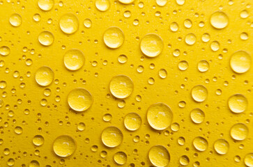 Rain droplets on yellow color background suitable for wallpaper decoration or design