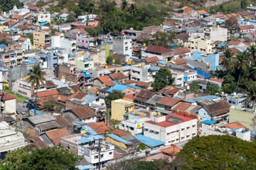 Fototapeta premium Aerial view of the rooftops of low rise houses in the small town of Shravanabelagola in Karnataka.