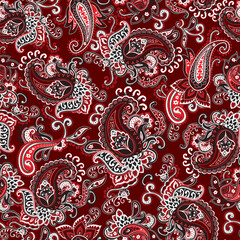 Seamless ornate red, black and white paisley pattern on a red background. Traditional batik flower motif for textile fabrics.