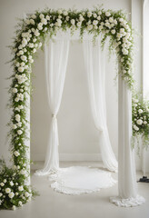 White floral archway draped with white fabric and lush greenery  standing tall with white flowers blooming  a white runner leads to the center of the archway.