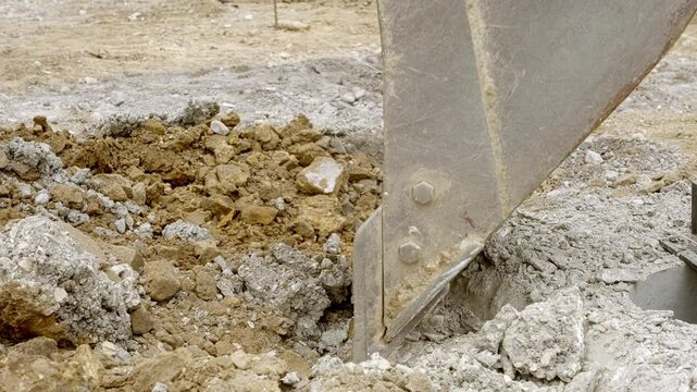 Excavation of land on new road construction site showcasing machinery in action