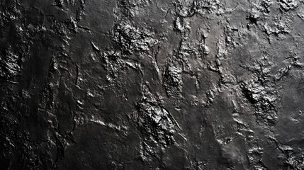 Fototapeta premium Textured black surface showcasing a rich, dramatic finish with a glossy sheen.
