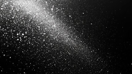Obraz premium A mesmerizing burst of sparkling dust against a dark backdrop, creating a magical, ethereal atmosphere.
