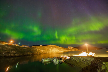 Northern lights in the town of Narsaq (South Greenland)