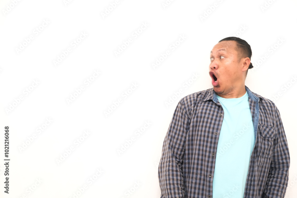 Wall mural shocked face or shocked expression of an asian man isolated on a white background