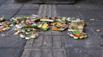 Canang Sari daily Offerings made by Balinese Hindus on the Ground of the streets of Bali