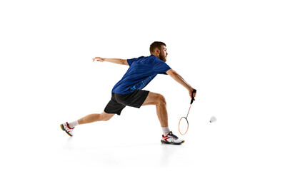 Fototapeta premium Badminton player lunges forward, perfectly timing his strike, against white background, shows intense concentration and athletic prowess. Concept of sport events, athleticism, focus. AD