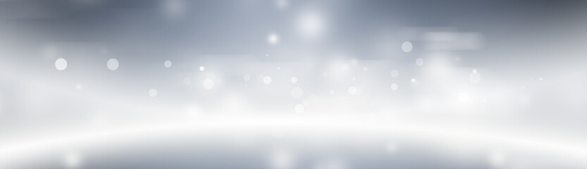 Blurred glitter effects background. Bright soft blue with hints of pearl color. Christmas background. Festive Christmas backdrop with holiday charm. Blurred bokeh light on dark blue background. Christ