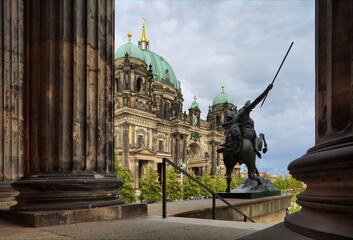Fototapeta premium Views of the Berliner Dom Through the Altes Museum Portico in Berlin