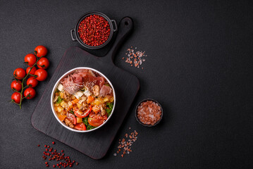 Appetizing salad with prosciutto, pumpkin, cheese and tomatoes
