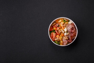 Appetizing salad with prosciutto, pumpkin, cheese and tomatoes
