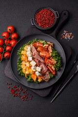 Appetizing salad with prosciutto, pumpkin, cheese and tomatoes