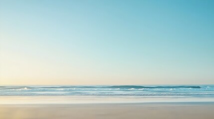 Fototapeta premium Endless ocean meets soft sands with a peaceful horizon and tranquil waters as gentle waves merge softly with the sky in this calming coastal scene