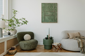 A modern interior with a sofa and elegant natural-colored accents. Large, spacious windows...