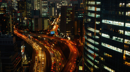 Night in the big city, with illuminated skyscrapers and busy traffic on the streets below.
