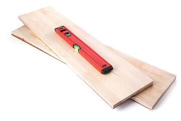 Wooden planks and building level isolated on white. Construction tools